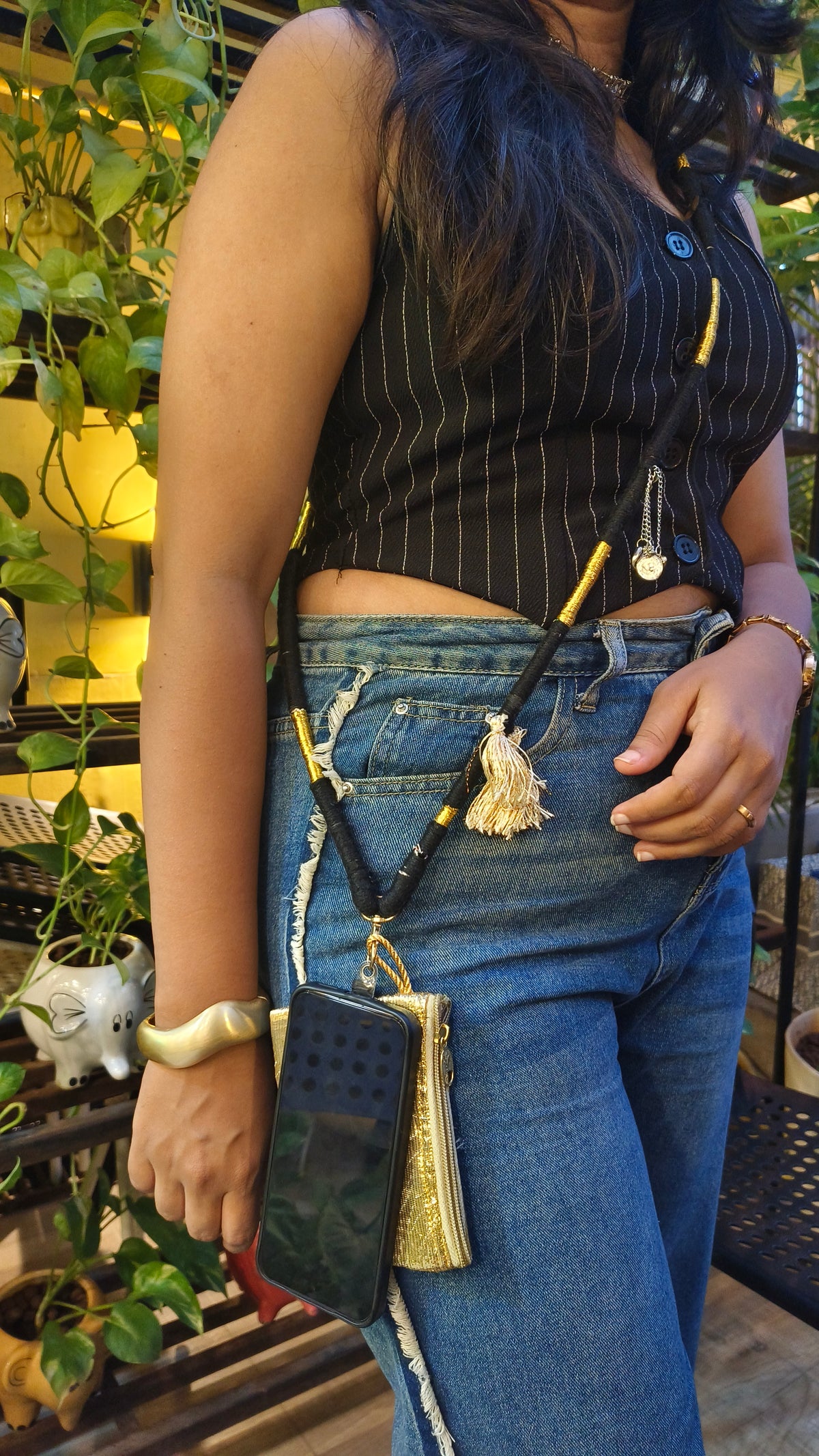 Woman wearing the Black Phone Sling 1