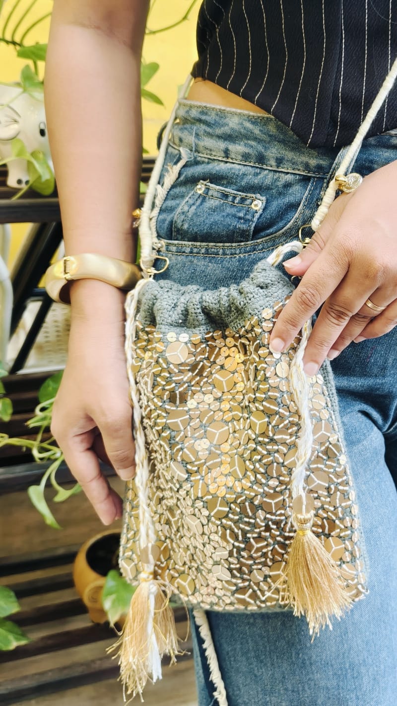 Woman wearing the Grey Gold Sequence Potli 1