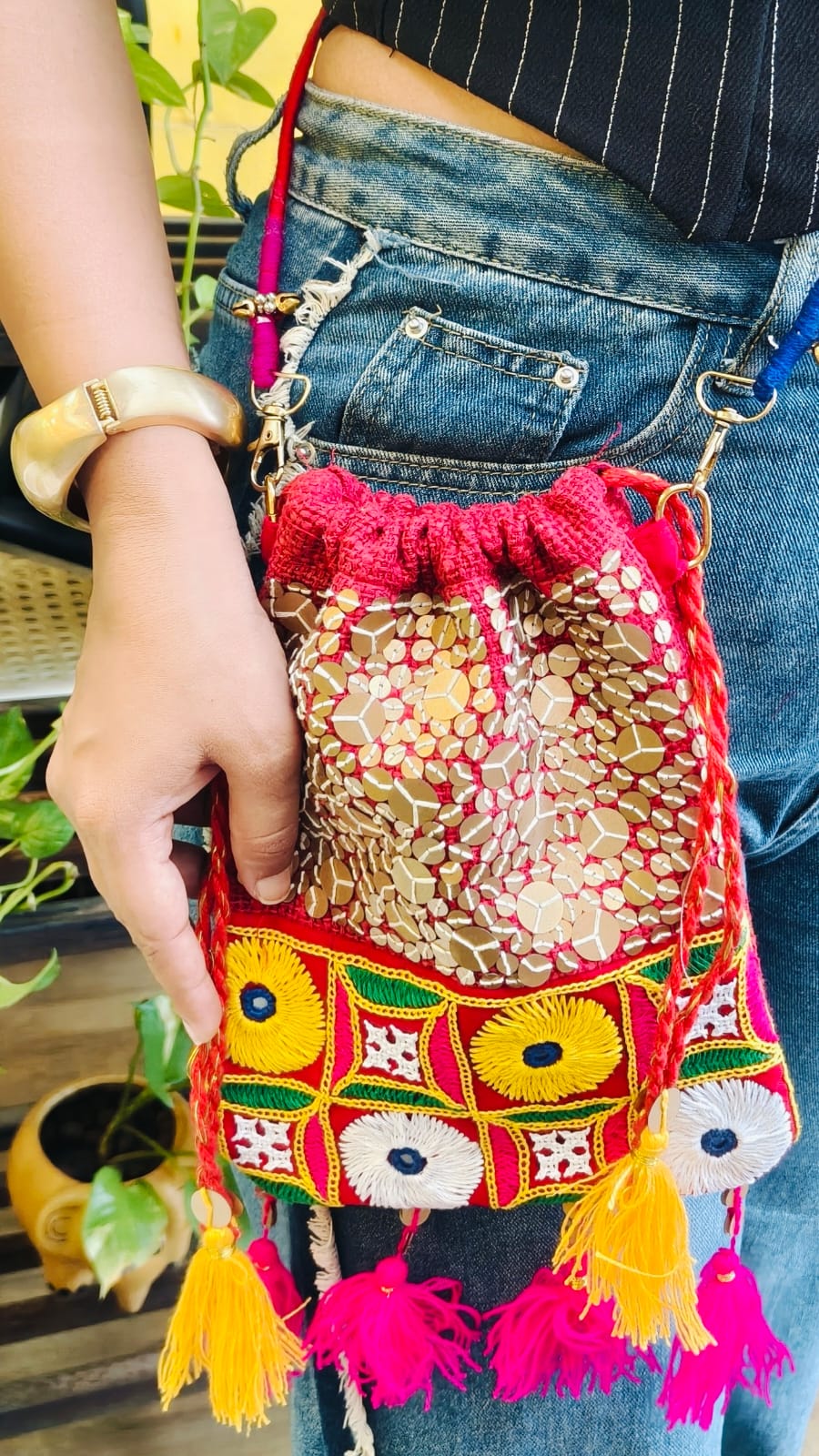 Woman wearing the Kutch Sequence Potli 1