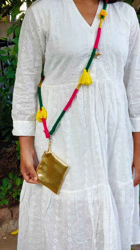 Woman wearing the green and pink thread-wrapped phone sling